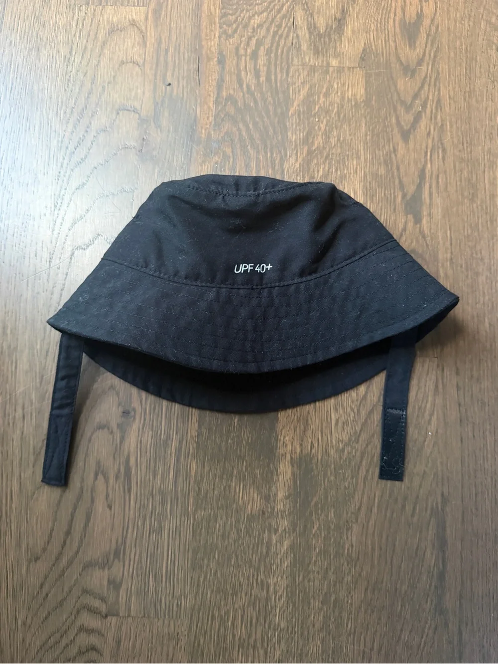 Nike Kids Black Bucket Hat with White Swoosh and Chin Straps